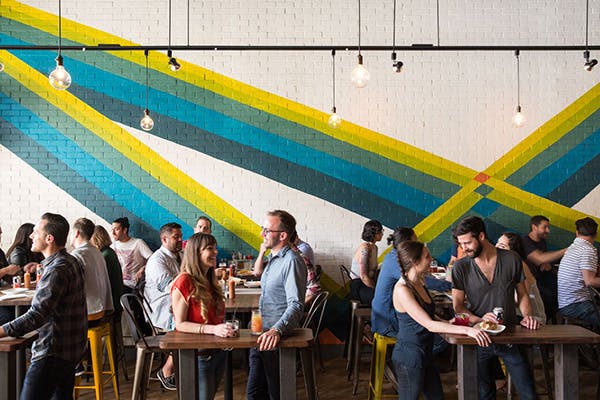 a group of people sitting on the restaurant