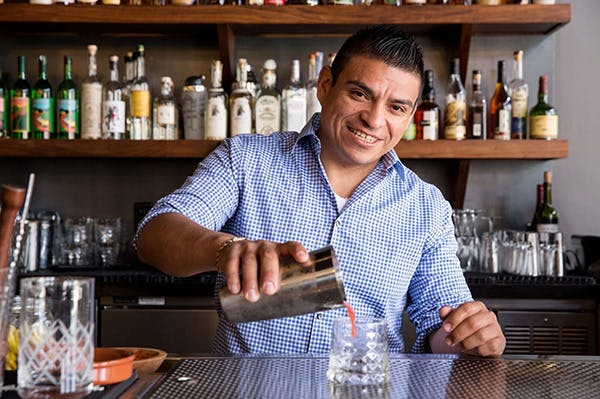 manny ramirez behind the bar serving an alcoholic mix