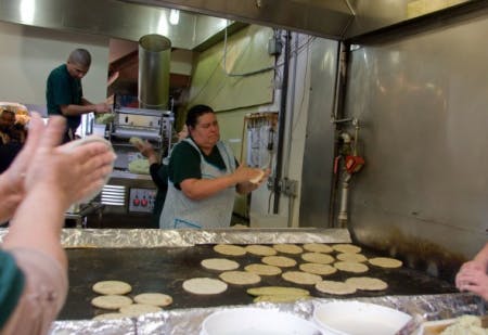 Screen Shot 2012-12-29 at 6.13.20 PM a woman making tortillas at la palma with her coworkers
