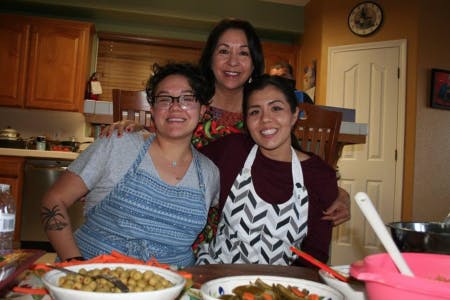 Alica, her mom, and her sister Lucy posing for a photo