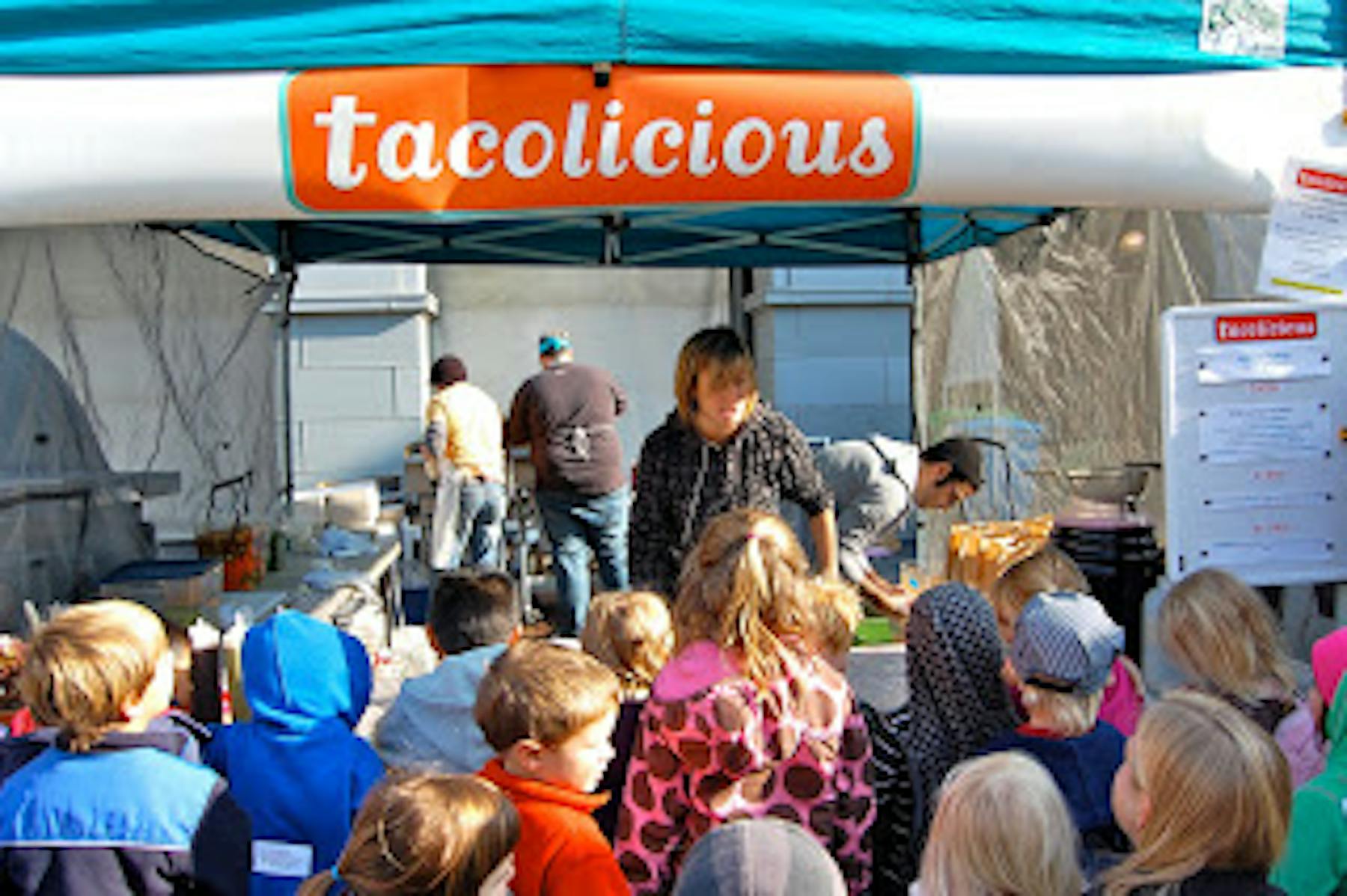 people outside a tacolicious tent