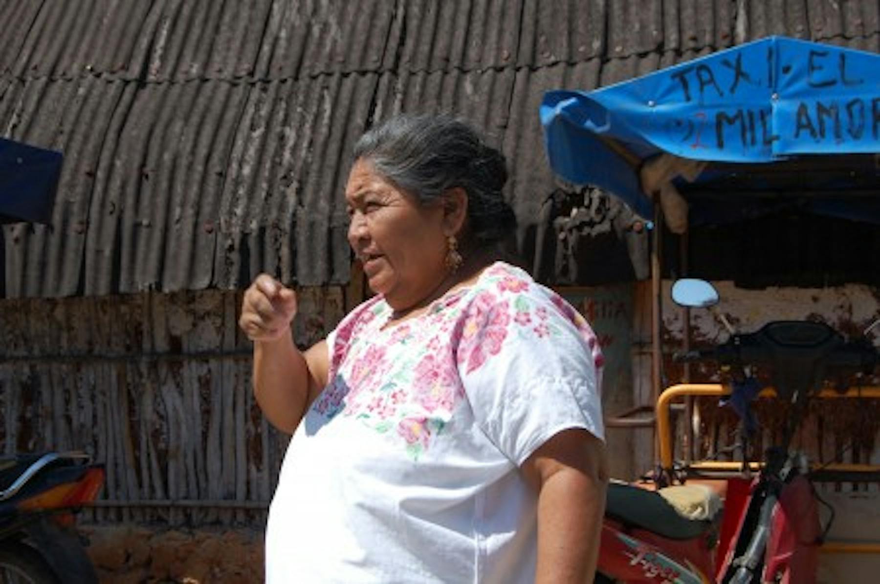 a woman giving directions to a house