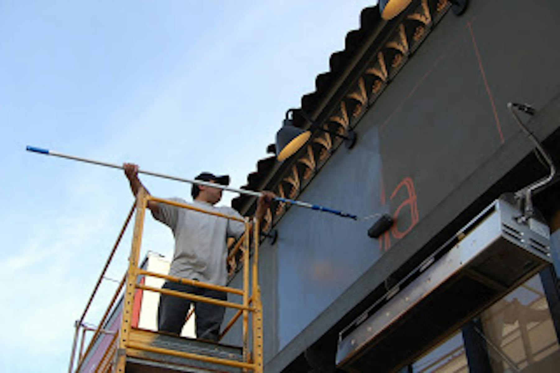 a man painting the wall