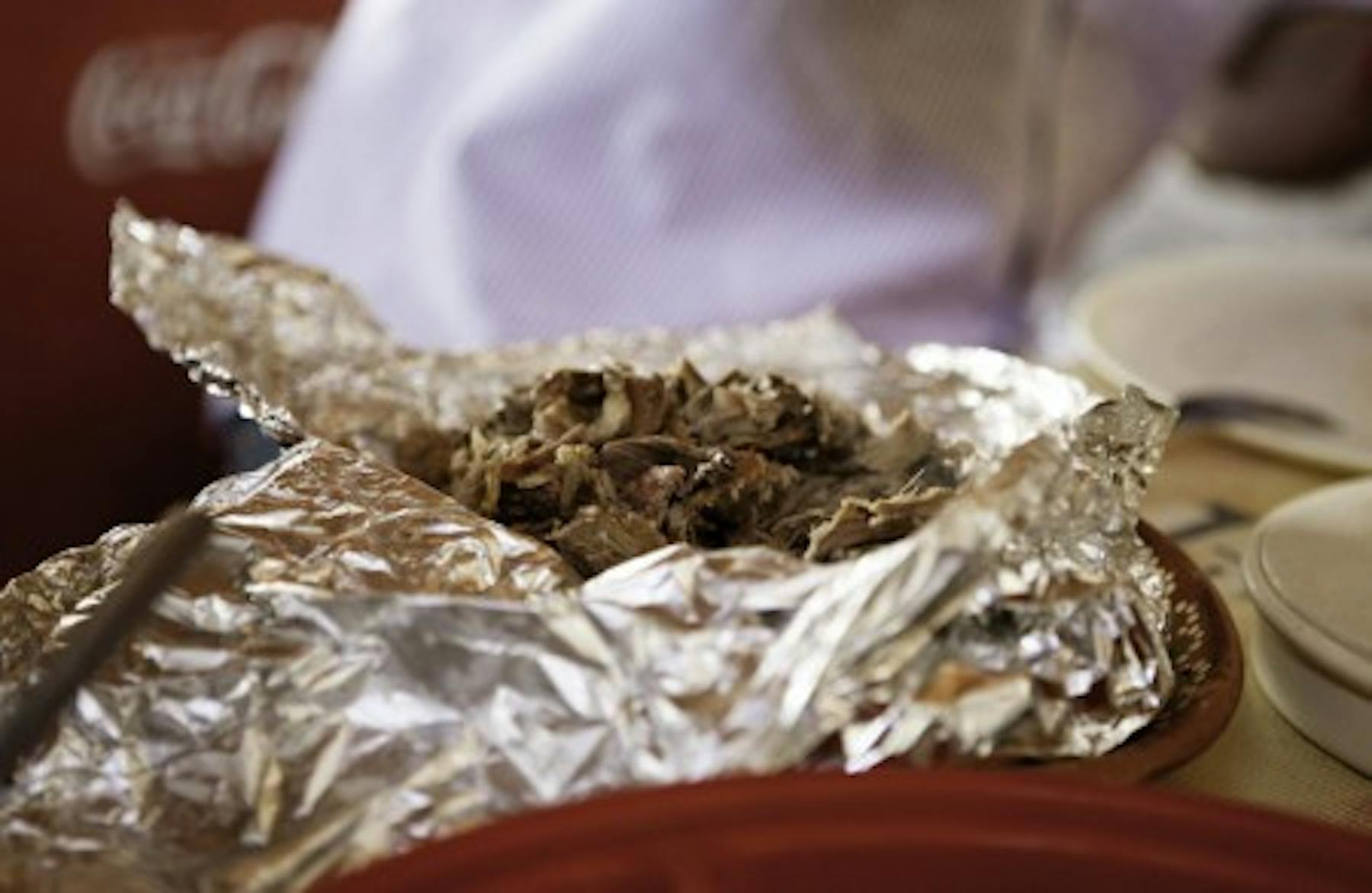 birria in an aluminum paper