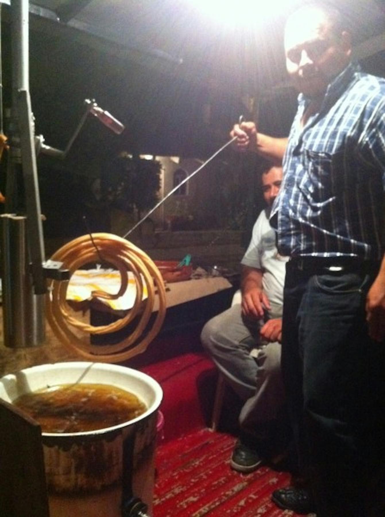 a man posing for the photo in front of a bowl