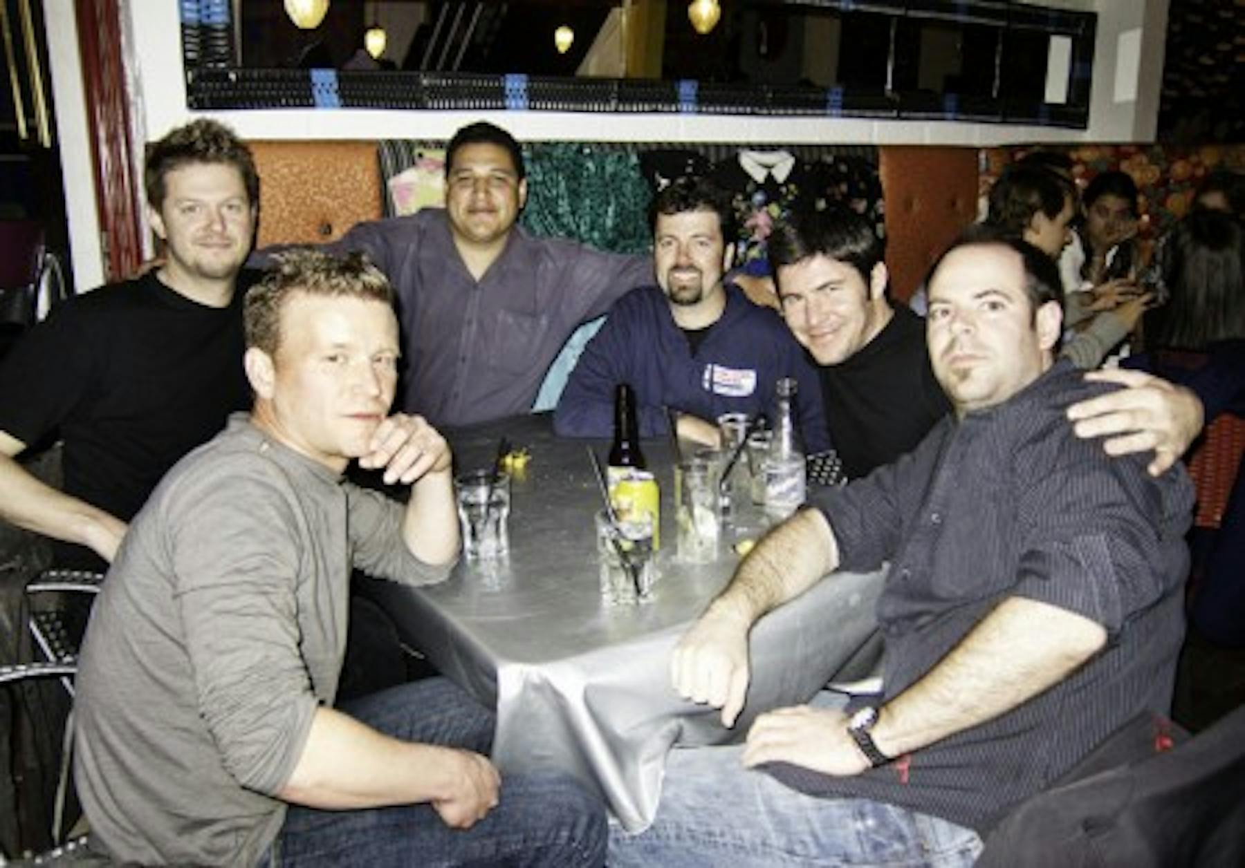 a group of men posing for a photo