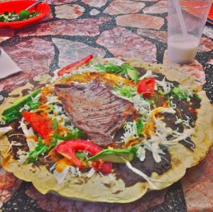 The tlayuda in Oaxaca, think Mexican pizza