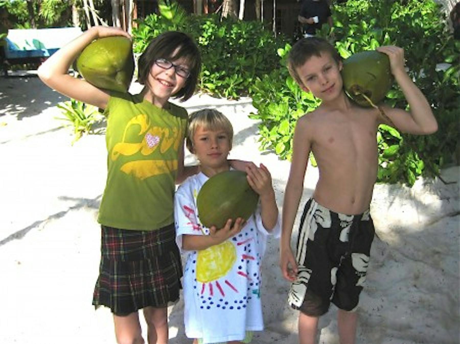 Mia, Moss and Silas at the house, getting ready for some coconut water for breakfast