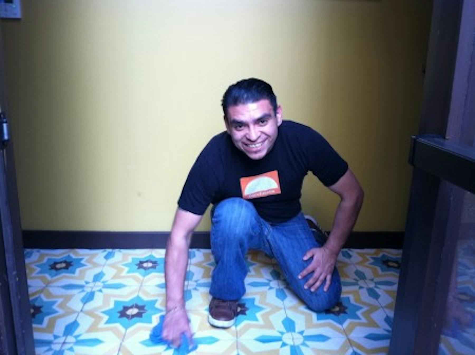 Manny ramirez smiling while cleaning the floor