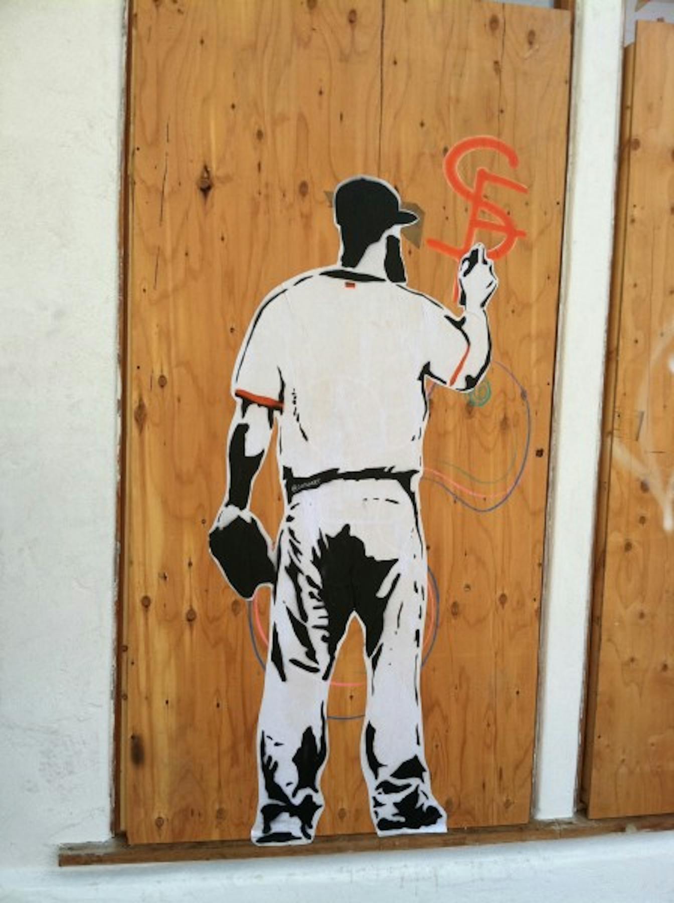 a painting of a man writing the letters S F