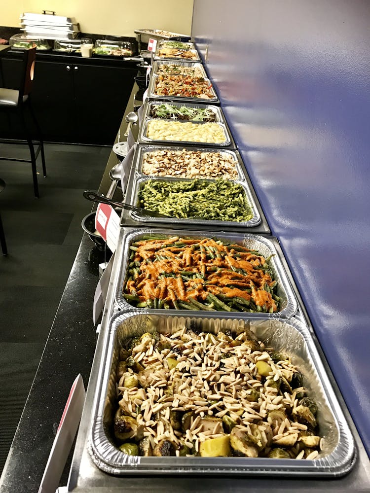 long buffet of meats and vegetables