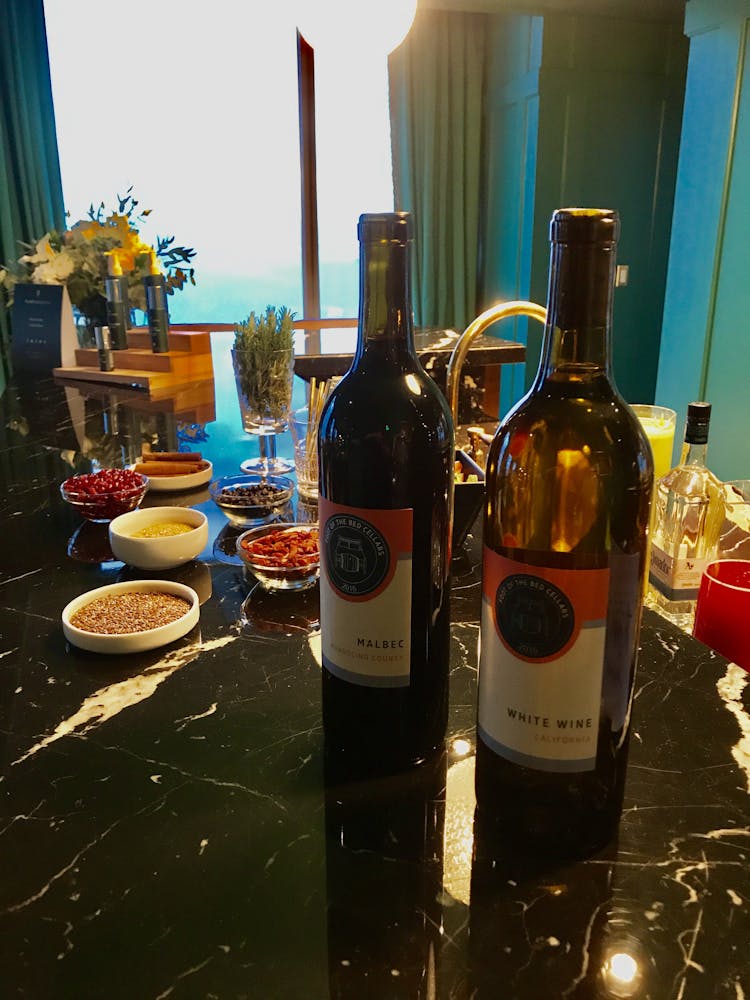 a black counter with two wine bottles on it