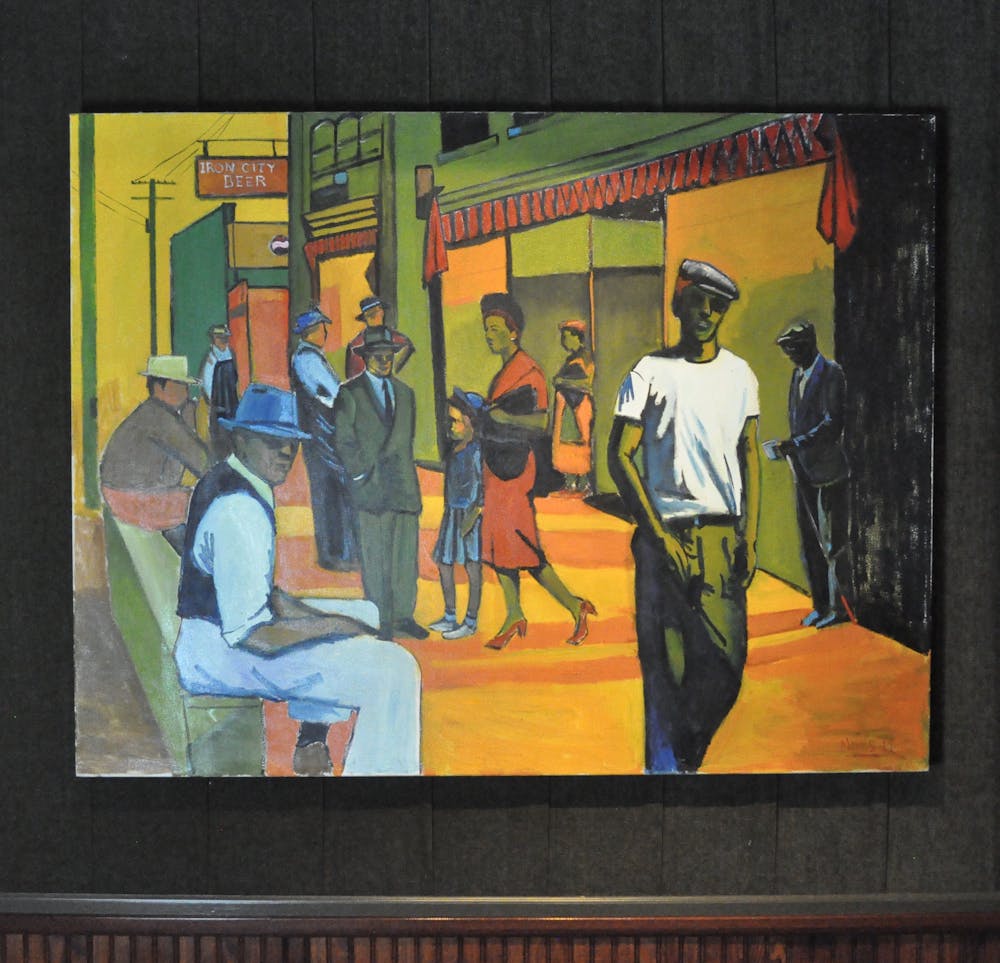 a group of people standing next to a painting