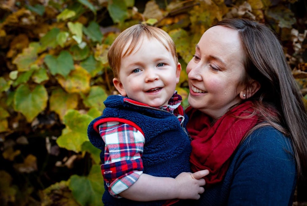 a little girl smiling at the camera
