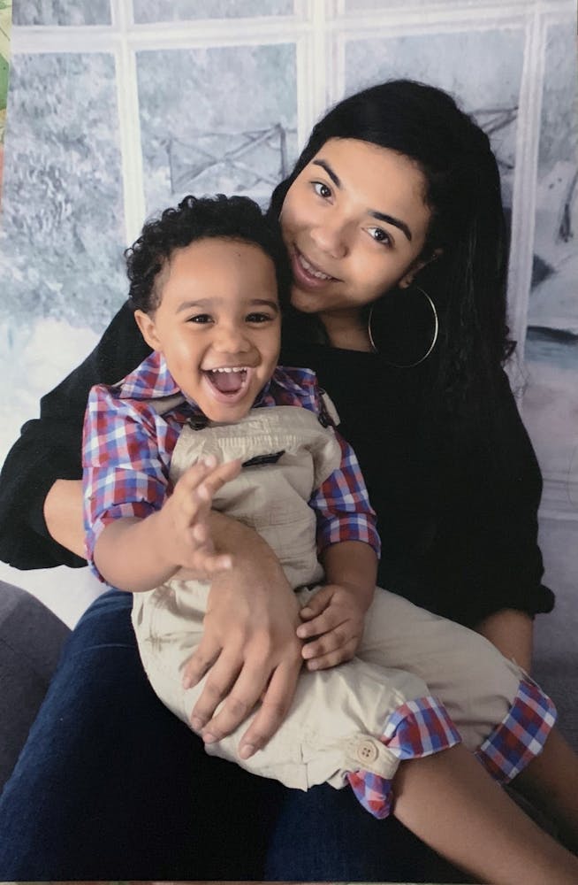a boy and a girl sitting on a table