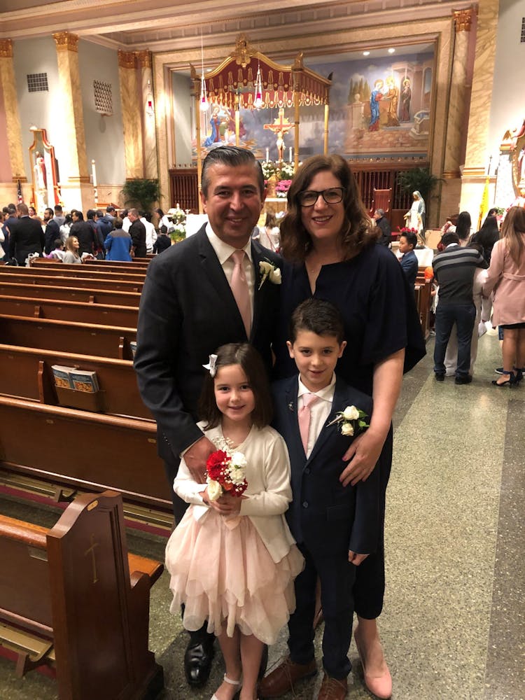 a group of people standing in front of a building